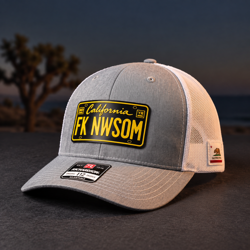 FK NWSOM California Leather Patch Trucker Hat — grey and white Richardson 112 trucker hat with black and yellow California license-plate-style leather patch, angled front view